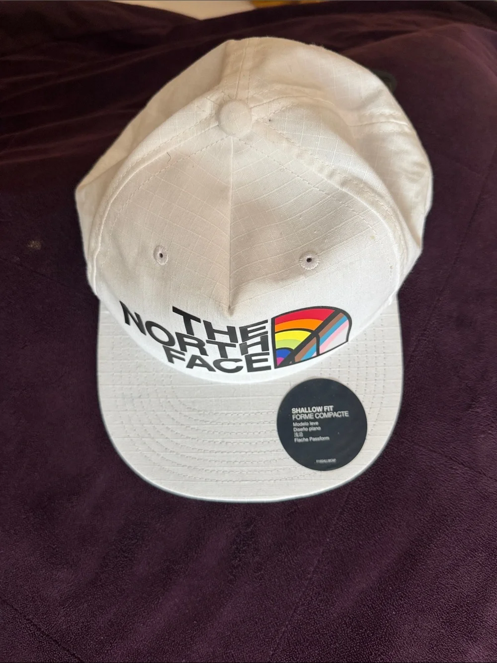 The North Face White Baseball Cap with Rainbow Logo Accent
